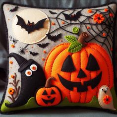 a decorative pillow with halloween decorations on it