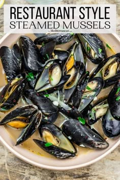 steamed mussels in a white bowl with text overlay that says restaurant style steamed mussels