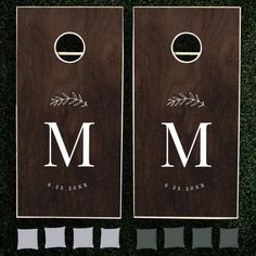 two wooden door hangers with the letter m on them