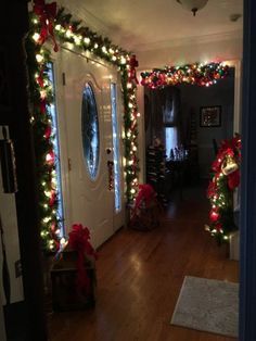 the hallway is decorated with christmas lights and wreaths