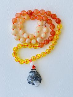 I am motivated to pursue my true purpose. I am comfortable with my power. I am ambitious and capable of whatever I desire. My solar plexus chakra is balanced. This purchase includes: Gemstone Mala, baggie, box, card including using your mala, intention setting and properties. GEMSTONES Calcite: Like an energetic vitamin, Calcite helps to keep your energy at its highest potential by removing energetic blocks and clearing negativity. It raises your vibration and uplifts your spirit, making it an e Spiritual Amber Beaded Necklaces With Natural Stones, Spiritual Amber Beaded Necklace With Natural Stones, Amber Beaded Necklace For Meditation, Spiritual Agate Crystal Necklaces For Healing, Meditation Necklace With Natural Stones And Mineral Crystal, Amber Crystal Necklace For Meditation With Natural Stones, Handmade Amber Crystal Necklace For Meditation, Amber Natural Stone Necklace, Natural Stones Pendant Crystal Necklace For Meditation