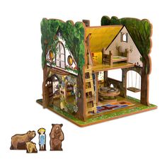 a wooden doll house with animals and trees