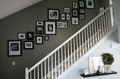 the stairs are decorated with black and white pictures