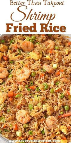 shrimp fried rice in a pan with carrots and peas