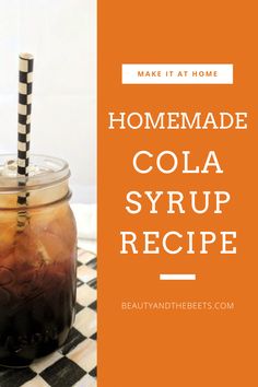 homemade cola syrup recipe in a mason jar on a checkered tablecloth with text overlay