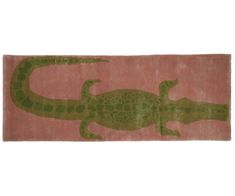 a pink rug with an alligator on it