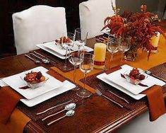 the table is set with place settings for two people to enjoy their meal or dinner