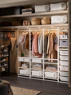 an organized closet with clothes and other items