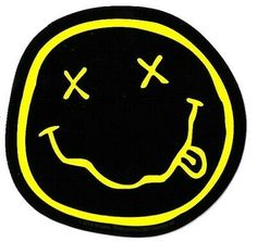 a smiley face drawn in yellow on a black background