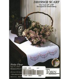 a basket with flowers sitting on top of a table