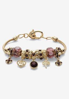 In a contemporary tapestry of colors and charms, this designer-inspired Bali-style birthstone beaded charm bracelet makes a stylish statement. No need to build a bracelet bead-by-bead... This wrist wrap comes completely full with a colorful array of beads, charms and spacers in the birthstone color of your choosing. Adjustable 8" length. Goldtone. Secured with a lobster clasp. Birthstones are simulated gemstones.Main Stone: 1 Round Faceted Cut Blue Crystal, 8.5 mm x 8.5 mm2 Round Faceted Cut Blu Charm Bracelet On Wrist, Pandora Bracelet Designs Unique, Vintage Jewelry Collection, Gold Charm Bracelet For Women, Vintage Charm Bracelet Gold, Elegant Charm Bracelet For Birthday And Valentine's Day, Affordable Rose Gold Charm Bracelet, Gold Whimsical Charm Bracelet, Hispanic Jewelry