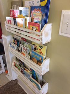 the bookshelf is filled with children's books and other things to read