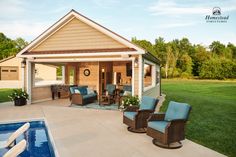 an outdoor living area with pool and hot tub