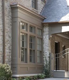 a large brick building with an iron gate