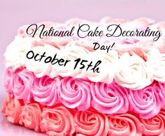 a pink and white cake sitting on top of a table next to a sign that says national cake decorating day