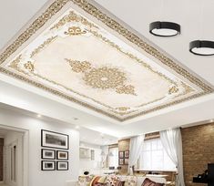 a living room filled with lots of furniture under a fancy ceiling light over a fire place