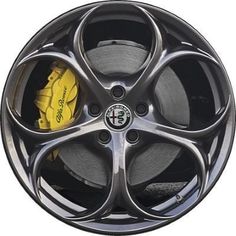 a wheel with yellow brake pads on it