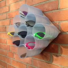 a wall mounted rack with sunglasses on it