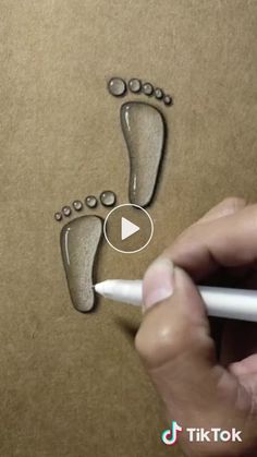 someone is drawing a foot with a marker