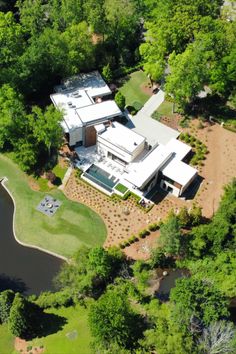 The property boasts a range of luxurious amenities, including a pond, a pool, a guest house and a large gas fire pit. Atlanta Mansions, Nature Preserve, Frank Lloyd, Frank Lloyd Wright, Ben Affleck, Lloyd Wright, Modern Homes, House Boat, Accounting