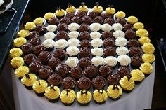 a large chocolate cake with yellow and white frosting