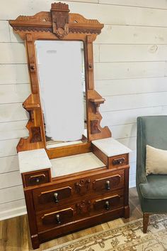 an old dresser with a mirror on top