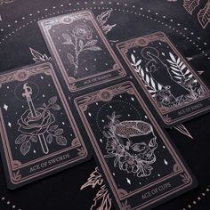 four playing cards with different designs on them