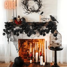 a fireplace with candles and decorations on it