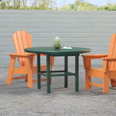 an orange and green table with two chairs