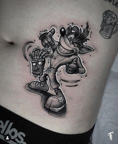 a cartoon character tattoo on the stomach