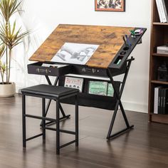 a wooden desk with two black chairs and a book shelf