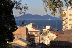 a view of the ocean and mountains from an apartment complex in san francisco, california