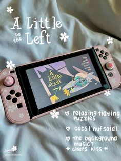 a pink nintendo wii game controller laying on top of a bed with the title, little left