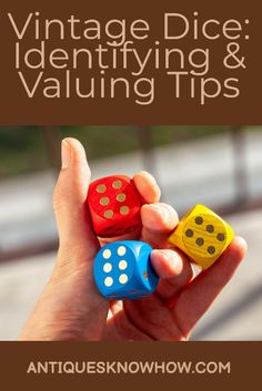 a hand holding three dices with the words vintage dice identifying and valuing tips