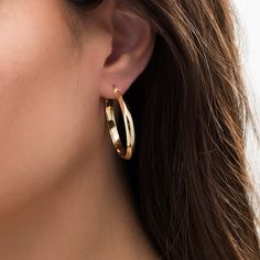 Deliver style and grace with these intriguing hoop earrings. Crafted in warm 10K gold, each 30.0mm hoop showcases a knife-edged tube. Polished to a bright shine, these earrings secure with latch backs. Tube Hoop Earrings, Style And Grace, Holiday Specials, Earring Backs, 10k Gold, Designer Earrings, Yellow Color, Fashion Earrings, Types Of Metal