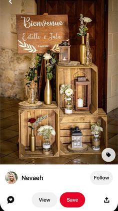 a wooden crate with flowers and candles on it