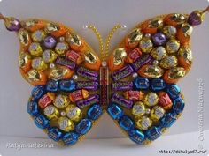 a butterfly made out of chocolates and candy