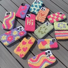 knitted cell phone cases are arranged on a table