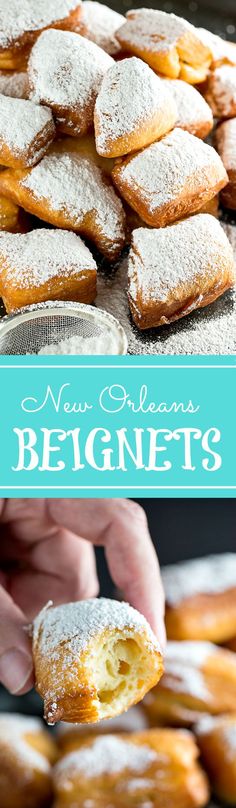 a hand holding a powdered sugar doughnut over a pile of new orleans beignets