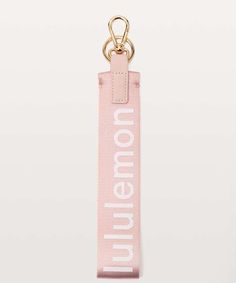 a pink lanyard keychain with the words, no one is illegal on it