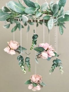 a mobile with flowers and leaves hanging from it