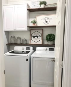 a white washer and dryer sitting in a laundry room next to each other