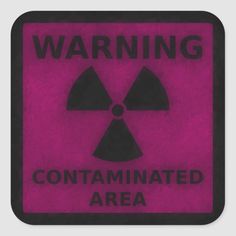 a pink and black warning sign with the words,'warning contained area'on it