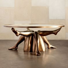 a bronze table with two people sitting on it