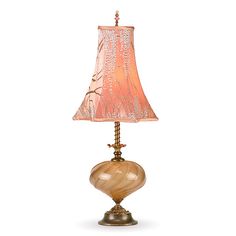 a table lamp with a pink shade on it's base and an orange flowered lampshade