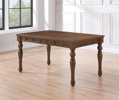 a wooden table sitting on top of a hard wood floor