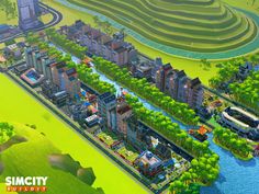 the city is surrounded by green hills and trees, with water running through it's center