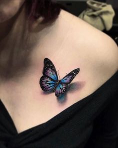 a woman with a butterfly tattoo on her chest