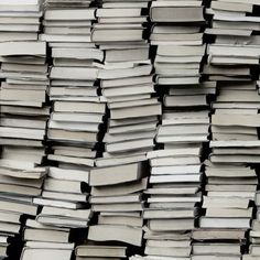 stacks of books stacked on top of each other