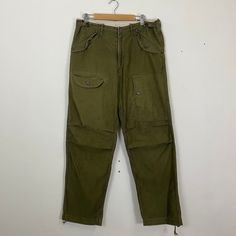 [DESCRIPTION] Please read the description first before buy my items‼️‼️‼️ Vtg John Bull Tactical Multipocket Utility Cargo Rare Pants All in good condition [MATERIAL] Cutton [MEASUREMENT] Measurement ( WHEN LAID FLAT ): Waist: 33 inch (recommended) Insean: 30.5 inch Length: 40.5 inch Front Rise: 11 inch Thigh: 22 inch Opening Leg: 16 inch [CONDITION] - All in good condition  - Have pinhole [PAYMENT & NOTICE] - We accept PayPal ONLY - No return/refund - All items will be post over shipping compan Military Full-length Parachute Pants With Pockets, Military Style Full-length Parachute Pants With Pockets, Combat Style Cargo Pants With Belt Loops For Outdoor, Military Style Cotton Parachute Pants, Combat Cargo Pants With Pockets, Combat Style Cargo Pants For Outdoor Activities, Military Parachute Pants With Side Pockets, Techwear Khaki Pants With Hip Pockets, Military Style Parachute Pants With Side Pockets